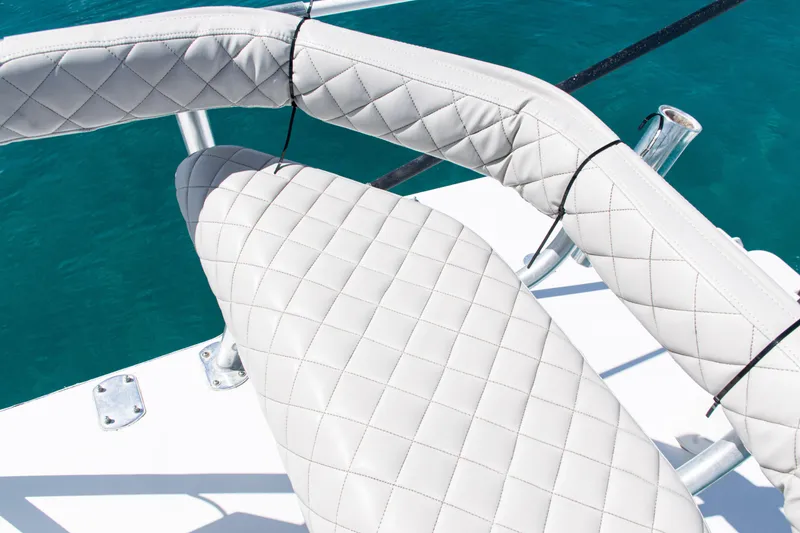 Slide: The Image of Quilted white seating on 2006 SeaVee 340B boat against blue water background. - 40