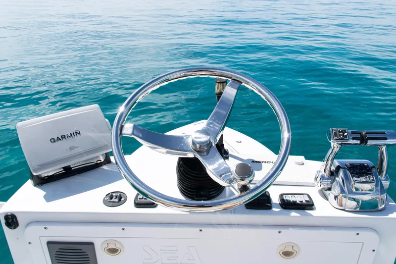 Slide: The Image of Steering console of 2006 SeaVee 340B boat with Garmin navigation system on clear water. - 41