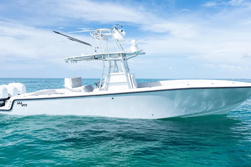 Slide: The Image of 2006 SeaVee 340B boat on clear blue ocean under a bright sky. - 43