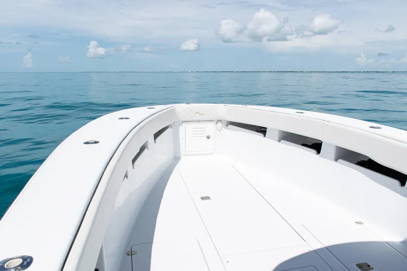 Slide: The Image of 2006 SeaVee 340B boat on calm ocean waters under a clear sky. - 8