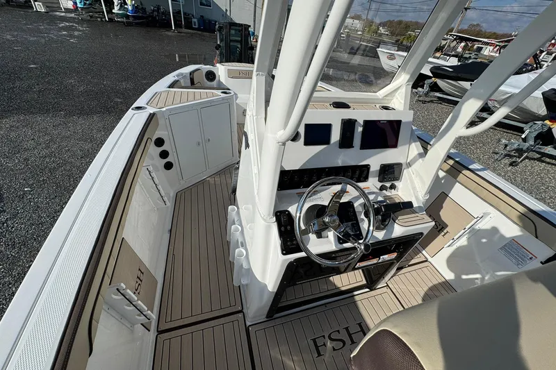 Slide: The Image of 2026 Yamaha Boats 222 FSH Sport E interior with seating and deck details. - 11