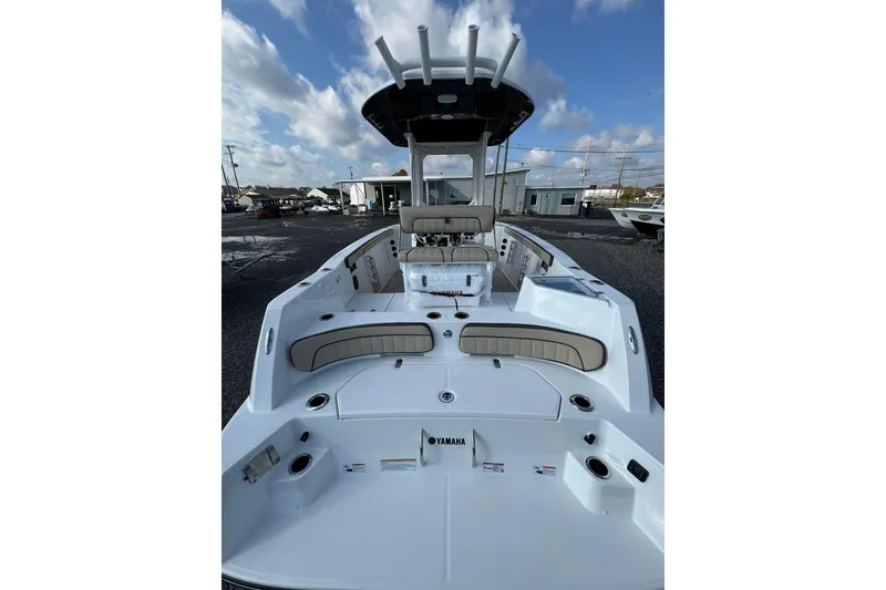Slide: The Image of 2026 Yamaha Boats 222 FSH Sport E interior with modern helm and spacious deck. - 12