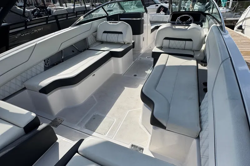 Slide: The Image of 2024 Regal LX6 boat interior with luxurious seating and modern design. - 11