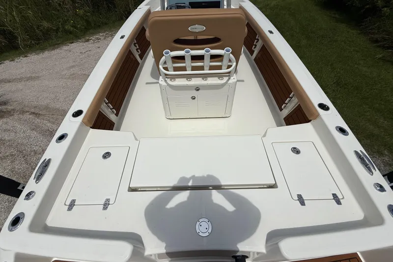 Slide: The Image of 2026 Pathfinder 2400 TRS boat interior with seating and storage compartments. - 12