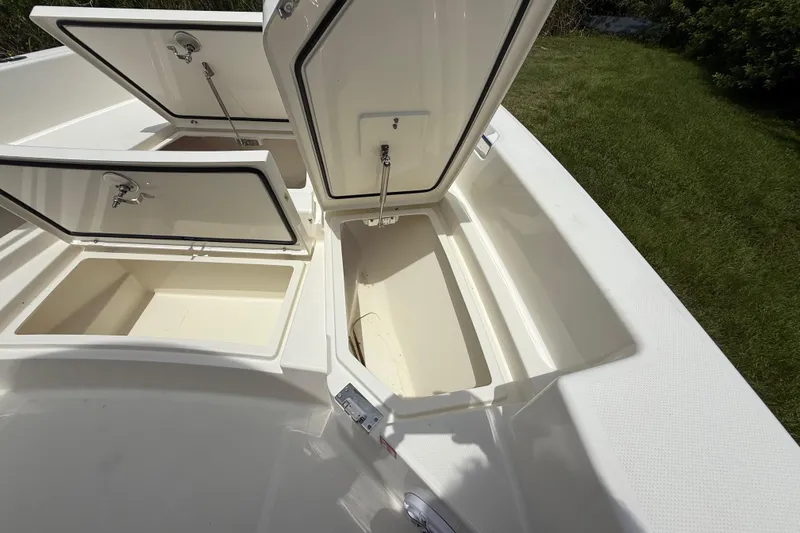 Slide: The Image of Open storage compartments on a 2026 Pathfinder 2400 TRS boat, showcasing ample space. - 39