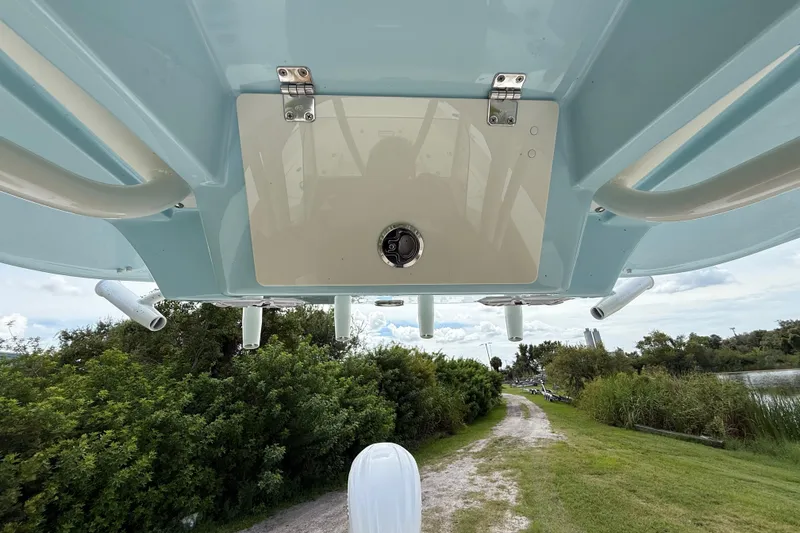 Slide: The Image of Underside view of 2026 Pathfinder 2400 TRS boat against a scenic outdoor backdrop. - 44