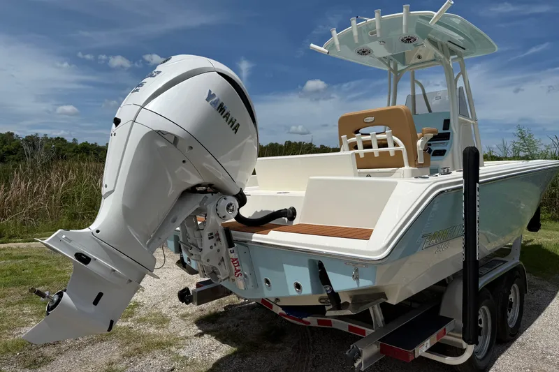 Slide: The Image of 2026 Pathfinder 2400 TRS boat with Yamaha outboard engine on trailer. - 5