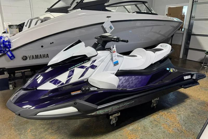 The Image of 2026 Yamaha WaveRunner VX Cruiser HO in showroom, sleek design, white and purple color scheme. - 0