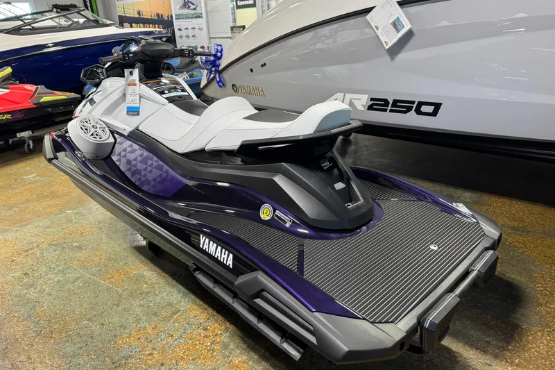 Slide: The Image of 2026 Yamaha WaveRunner VX Cruiser HO in showroom, sleek design, purple accents. - 5