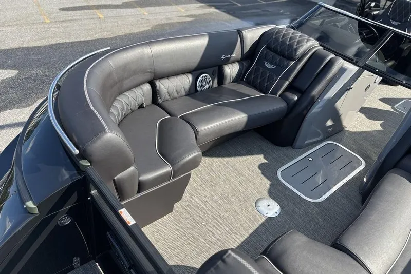 Slide: The Image of Luxurious seating on 2024 Bennington 25 QFBWA pontoon boat, featuring elegant black upholstery. - 13