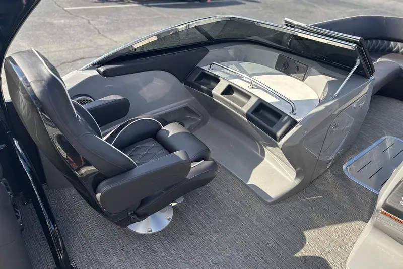 Slide: The Image of 2024 Bennington 25 QFBWA boat interior with sleek helm and comfortable seating. - 14