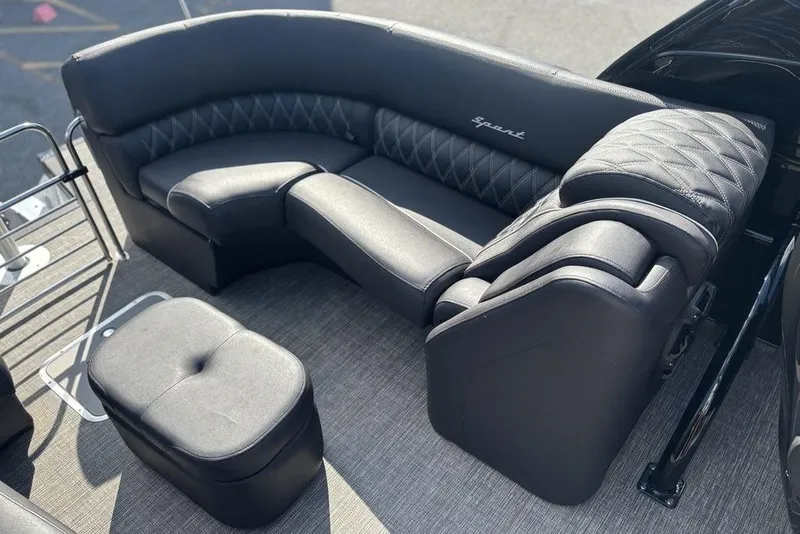 Slide: The Image of Luxurious seating on 2024 Bennington 25 QFBWA pontoon boat, featuring elegant black upholstery. - 19