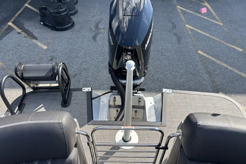 Slide: The Image of 2024 Bennington 25 QFBWA boat with Mercury outboard motor and swim platform. - 20