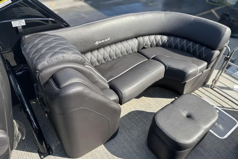 Slide: The Image of Luxurious seating on 2024 Bennington 25 QFBWA pontoon boat, featuring elegant black upholstery. - 23