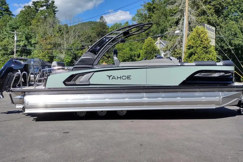 The Image of 2026 Tahoe Pontoon Grand Tahoe LTD Cruise Rear Bench on display outdoors. - 1