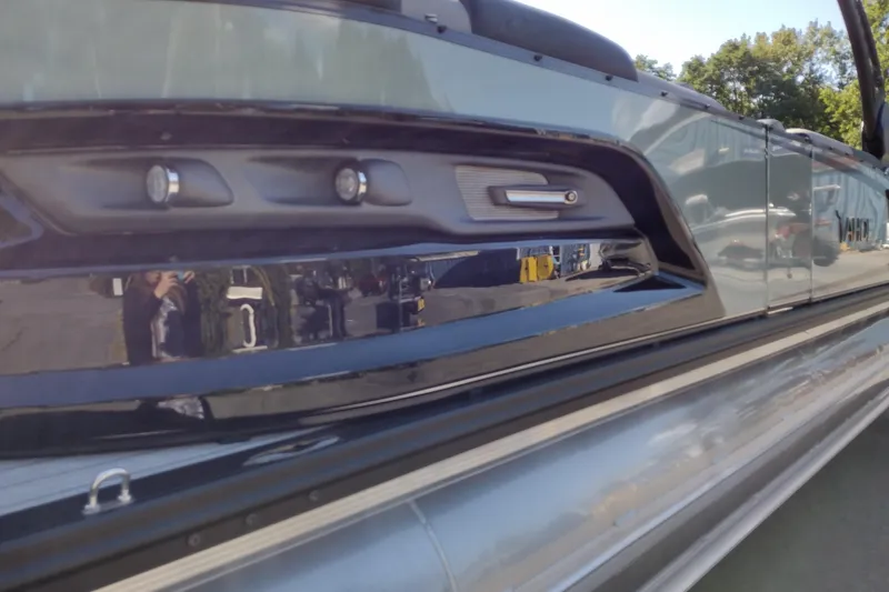 Slide: The Image of 2026 Tahoe Pontoon Grand Tahoe LTD Cruise Rear Bench, sleek design with reflective surface. - 13