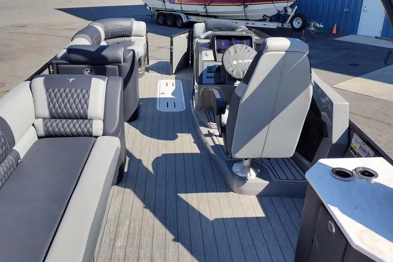 Slide: The Image of 2026 Tahoe Pontoon Grand Tahoe LTD Cruise Rear Bench interior with luxurious seating and modern controls. - 15