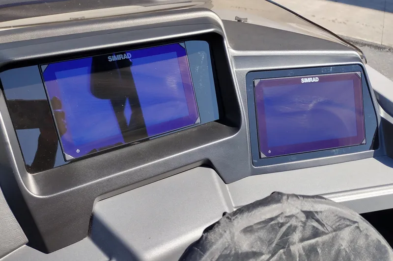 Slide: The Image of Dashboard of 2026 Tahoe Pontoon Grand Tahoe LTD with dual Simrad displays. - 27