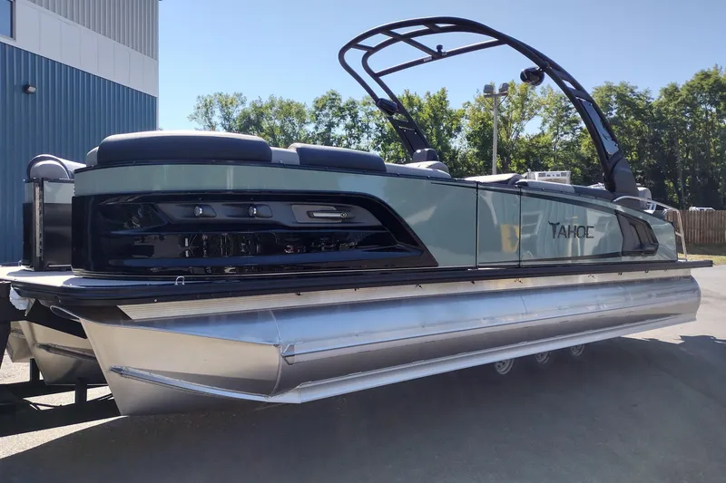 Slide: The Image of 2026 Tahoe Pontoon Grand Tahoe LTD Cruise Rear Bench, sleek design, parked outdoors. - 3