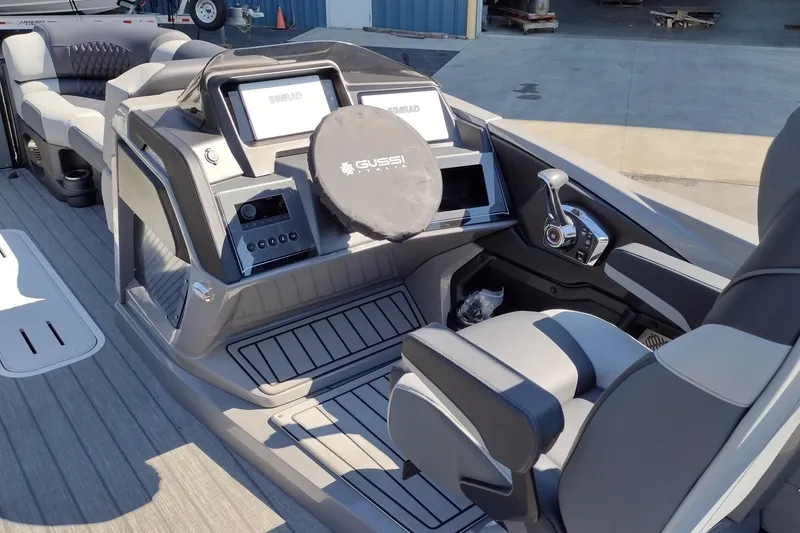 Slide: The Image of 2026 Tahoe Pontoon Grand Tahoe LTD Cruise Rear Bench interior with modern controls and seating. - 30