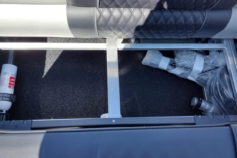Slide: The Image of Under-seat storage of 2026 Tahoe Pontoon Grand Tahoe LTD Cruise Rear Bench with fire extinguisher. - 35