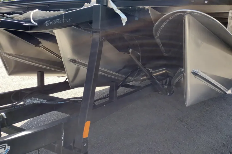 Slide: The Image of 2026 Tahoe Pontoon Grand Tahoe LTD Cruise Rear Bench on trailer, showcasing pontoon structure. - 54