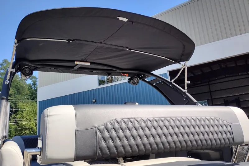 Slide: The Image of 2026 Tahoe Pontoon Grand Tahoe LTD Cruise Rear Bench with canopy, showcasing luxury seating. - 55