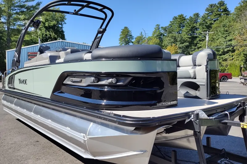 Slide: The Image of 2026 Tahoe Pontoon Grand Tahoe LTD Cruise Rear Bench, sleek design, parked outdoors. - 6
