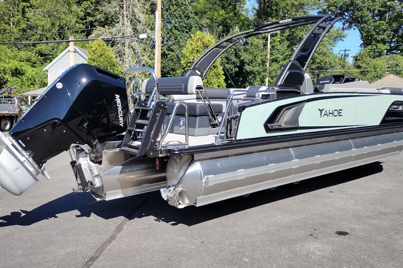 Slide: The Image of 2026 Tahoe Pontoon Grand Tahoe LTD Cruise Rear Bench on display outdoors. - 7