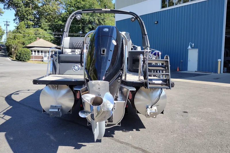 Slide: The Image of 2026 Tahoe Pontoon Grand Tahoe LTD Cruise Rear Bench at dockside, showcasing rear view and propeller. - 8