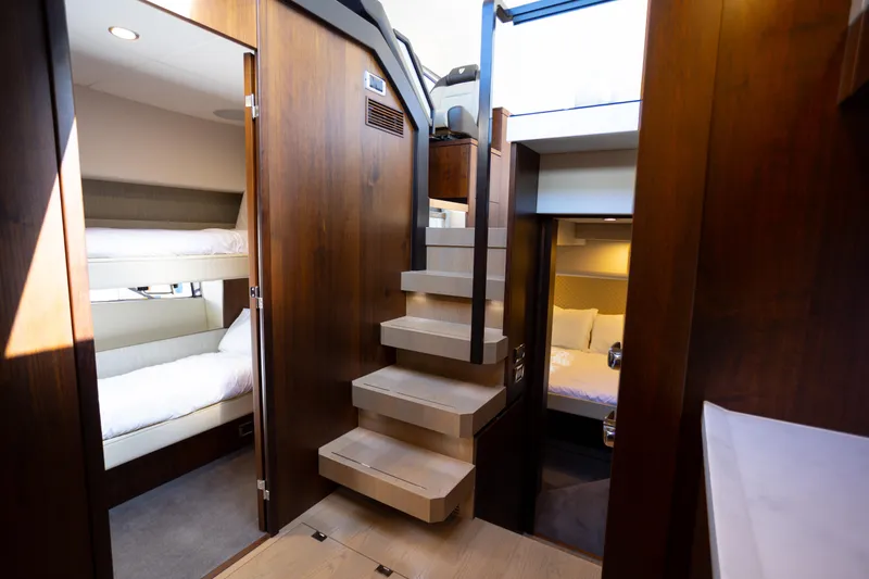 Slide: The Image of Luxurious interior of 2025 Fairline Squadron 50 yacht with modern wooden finishes. - 10