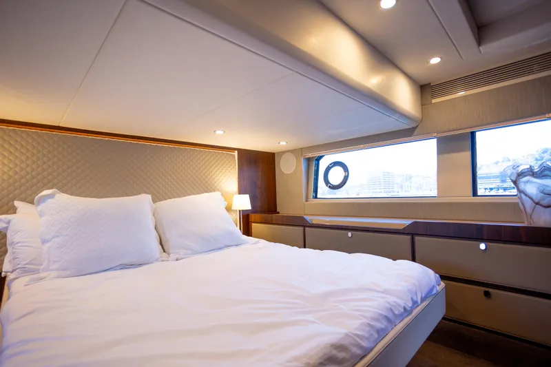 Slide: The Image of Luxurious bedroom interior of 2025 Fairline Squadron 50 yacht with elegant bedding. - 13