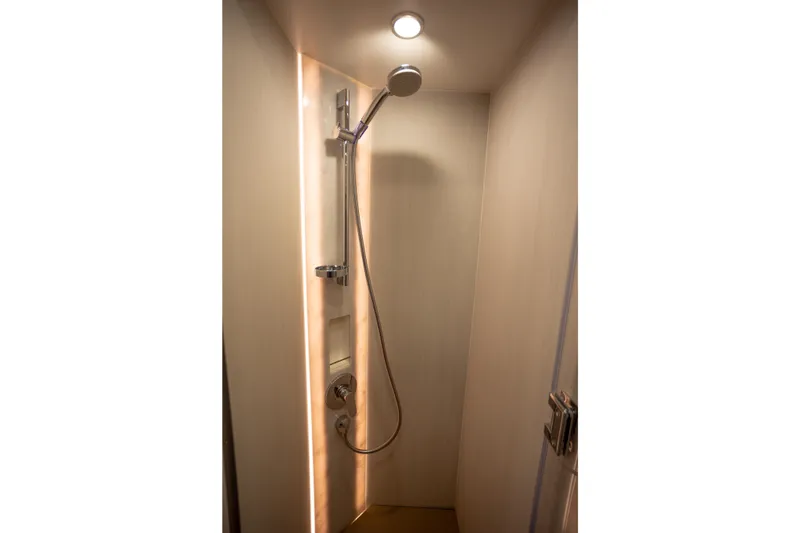 Slide: The Image of Modern shower area in 2025 Fairline Squadron 50 yacht, featuring sleek design and lighting. - 15