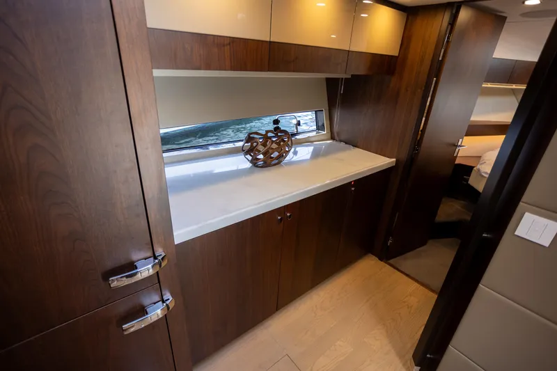 Slide: The Image of Luxurious interior of 2025 Fairline Squadron 50 yacht with elegant wood finishes. - 18