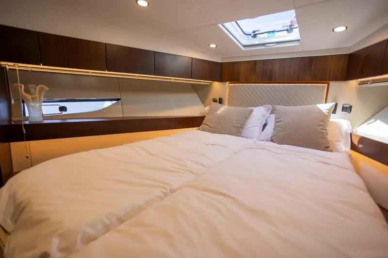 Slide: The Image of Luxurious bedroom interior of 2025 Fairline Squadron 50 yacht with elegant bedding and modern design. - 21