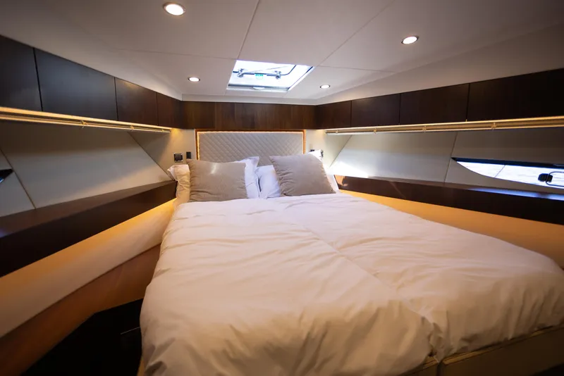 Slide: The Image of Luxurious cabin interior of 2025 Fairline Squadron 50 yacht with cozy bedding. - 22