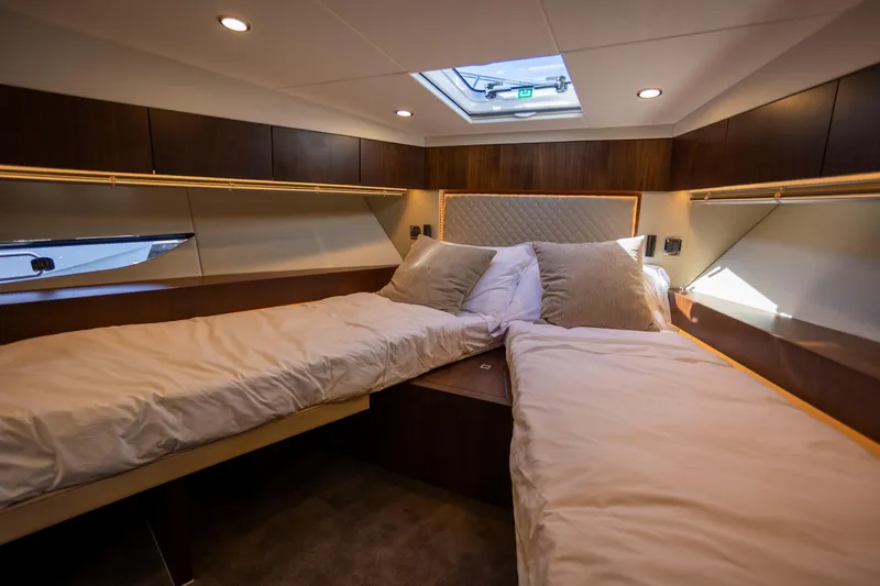 Slide: The Image of Luxurious cabin interior of 2025 Fairline Squadron 50 yacht with twin beds. - 24