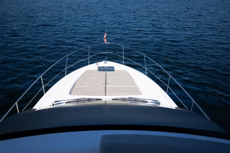 Slide: The Image of 2025 Fairline Squadron 50 yacht cruising on open water, showcasing sleek design. - 31