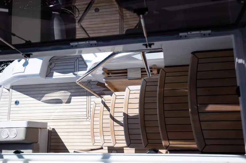 Slide: The Image of 2025 Fairline Squadron 50 yacht deck with elegant wooden flooring. - 32