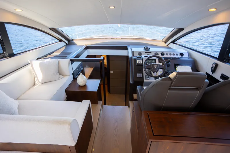 Slide: The Image of Luxurious interior of 2025 Fairline Squadron 50 yacht with modern helm and seating. - 5