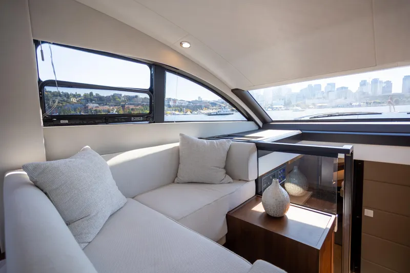 Slide: The Image of Luxurious interior of 2025 Fairline Squadron 50 yacht with city skyline view. - 6