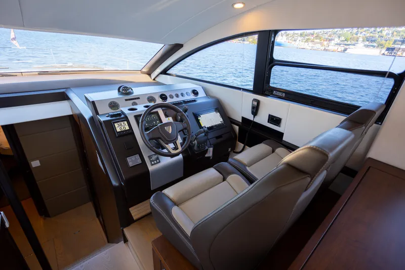 Slide: The Image of Luxurious helm of 2025 Fairline Squadron 50 yacht with modern controls and panoramic view. - 8
