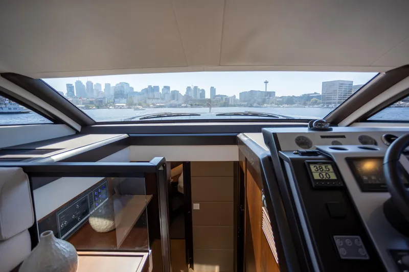 Slide: The Image of Interior view of 2025 Fairline Squadron 50 yacht with city skyline through windows. - 9