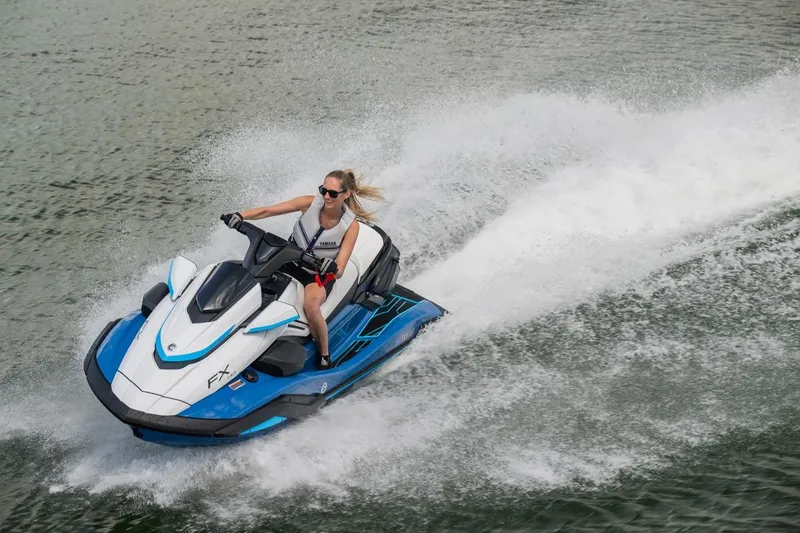 Slide: The Image of 2026 Yamaha WaveRunner FX HO jet ski speeding on water with rider. - 9