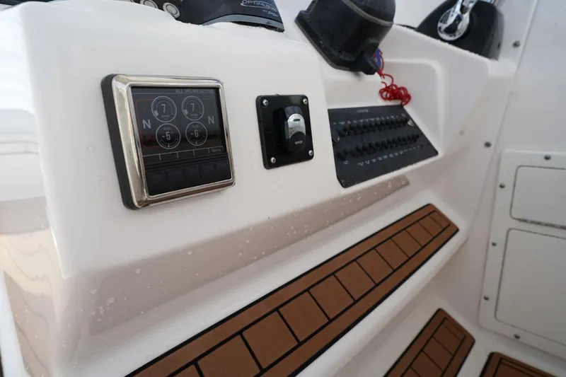 Slide: The Image of Control panel of a 2016 Edgewater 280 CX boat with digital display and switches. - 25