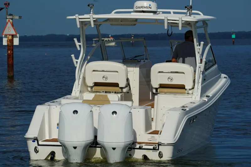 Slide: The Image of Edgewater 280 CX 2016 boat with dual engines on calm water. - 30