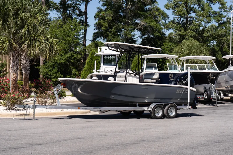 The Image of 2026 Carolina Skiff 22 Ultra Elite boat on trailer, parked outdoors. - 1