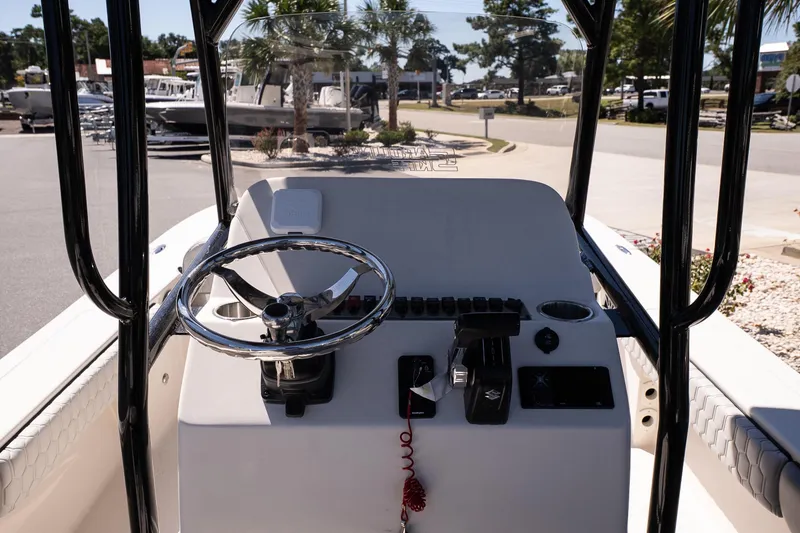 Slide: The Image of 2026 Carolina Skiff 22 Ultra Elite boat console with steering wheel and controls. - 10