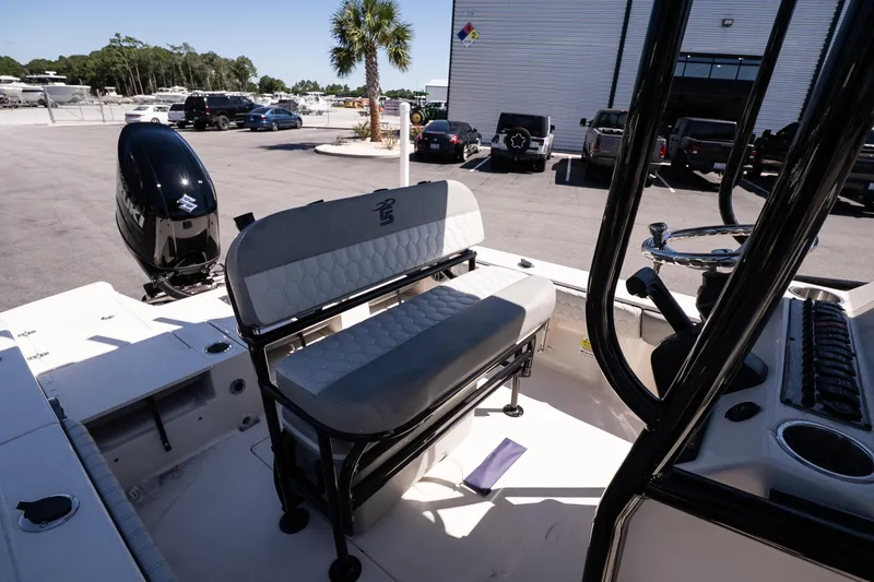 Slide: The Image of 2026 Carolina Skiff 22 Ultra Elite boat interior with seating and steering console. - 11