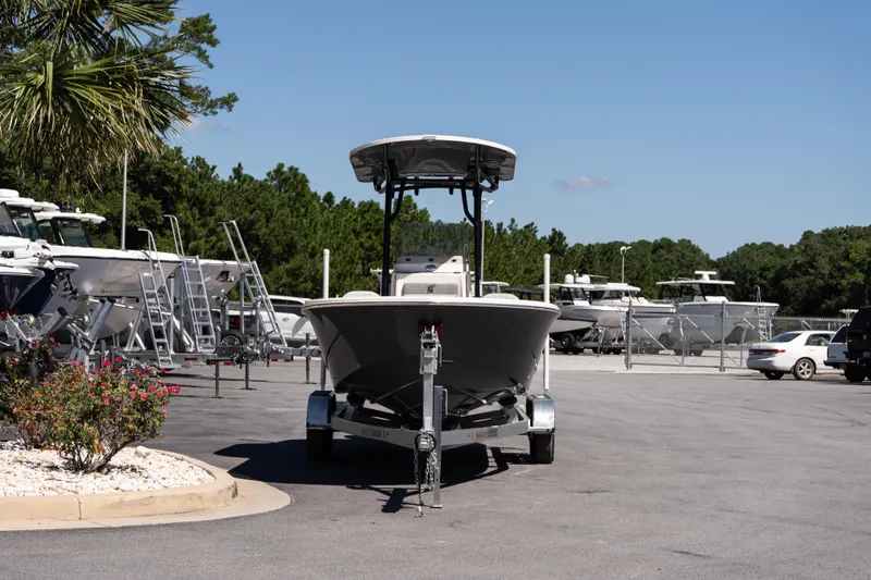 Slide: The Image of 2026 Carolina Skiff 22 Ultra Elite boat on trailer in dealership lot. - 3